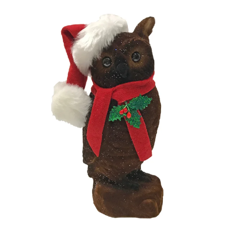 Owl flocked brown with Santa hat by Ino Schaller